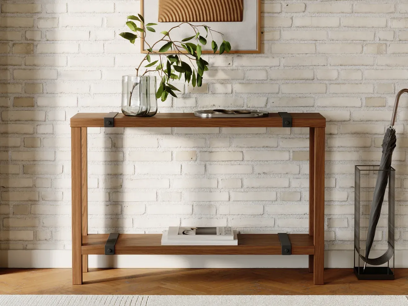 The same Dragonfly Industrial Entry Table rendered in walnut, front view against a white brick wall